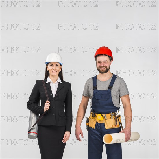 Woman engineer builder standing with whatman