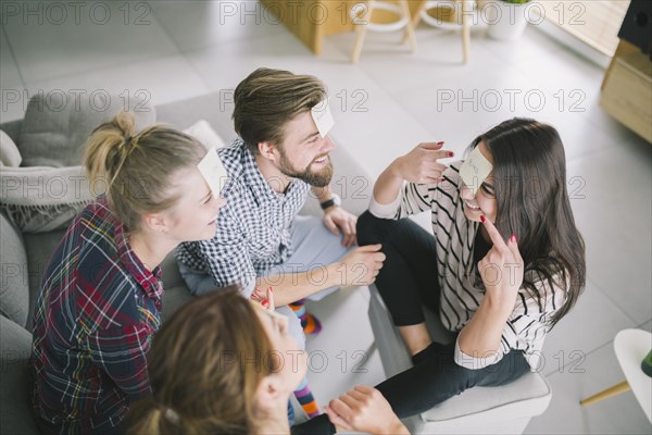 Woman guessing name while playing with friends