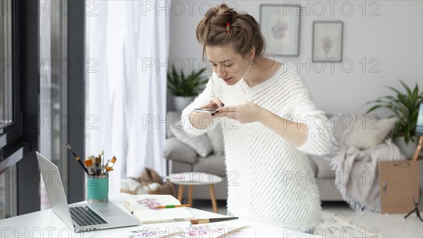 Woman making vlog her drawings