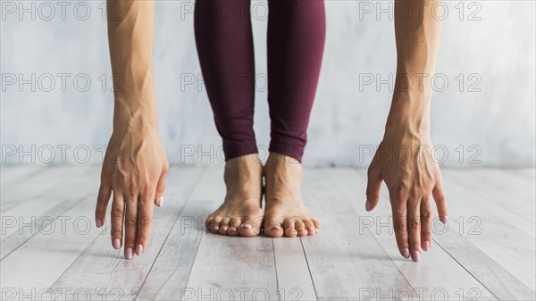 Woman standing forward bend pose