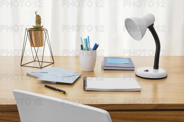 Workspace composition with desk lamp