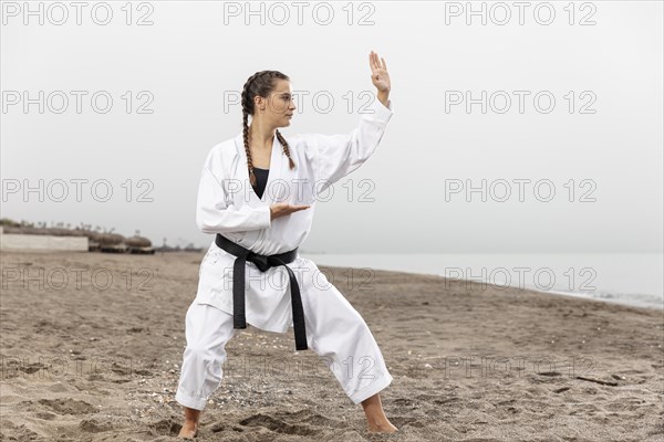 Young girl karate costume exercising