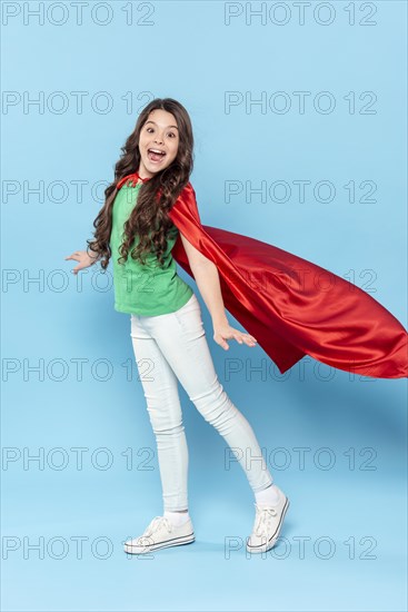 Young girl with hero costume