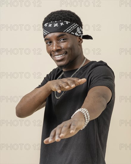 Young handsome man posing with bandana