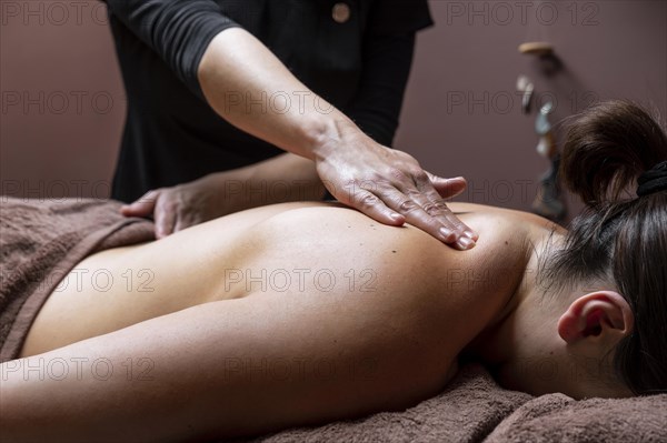 Young woman having treatment beauty salon