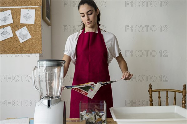 Young woman tearing paper workshop