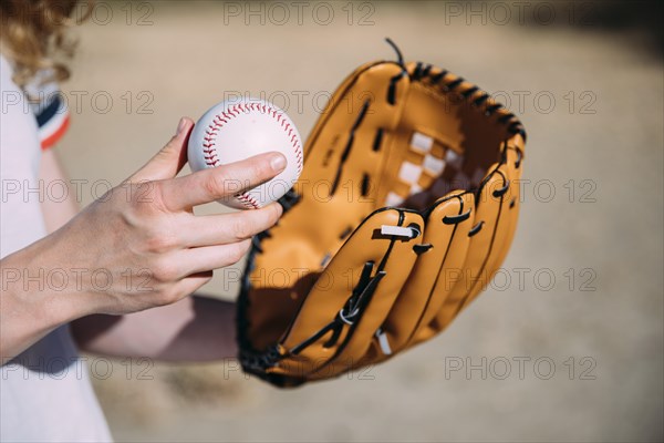 Young woman with baseball glove