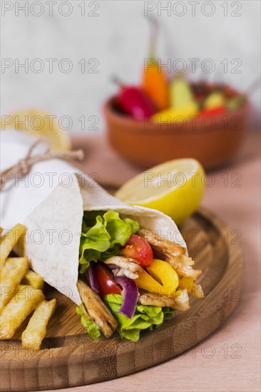 Arabic kebab sandwich wrapped white paper high view