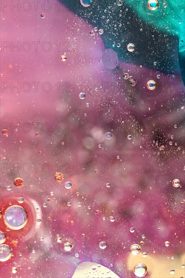 Beautiful bright colored background with oil drops