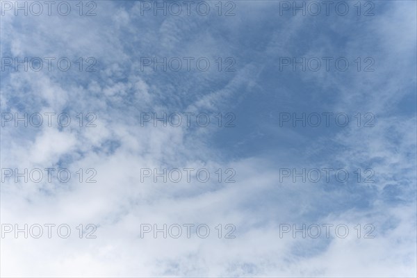 Blue sky with scattered white clouds