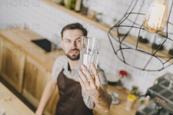 Blurred man looking glass