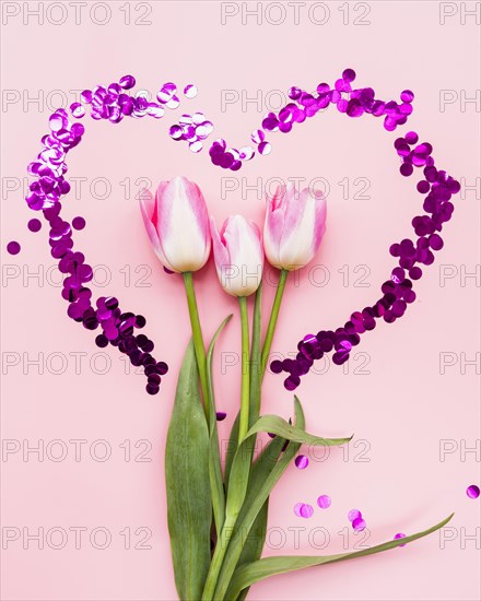 Bouquet flowers heart frame pink background