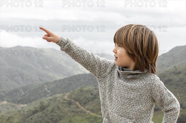 Boy pointing out