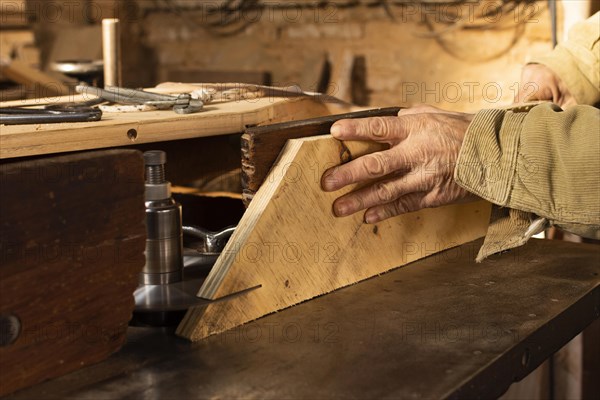 Carpenter cutting wood