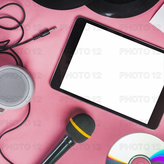 Cd vinyl record microphone speaker digital tablet pink background