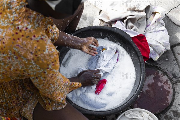 Close up african woman washing clothes