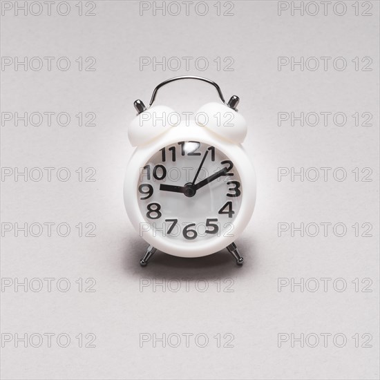 Close up alarm clock plain background