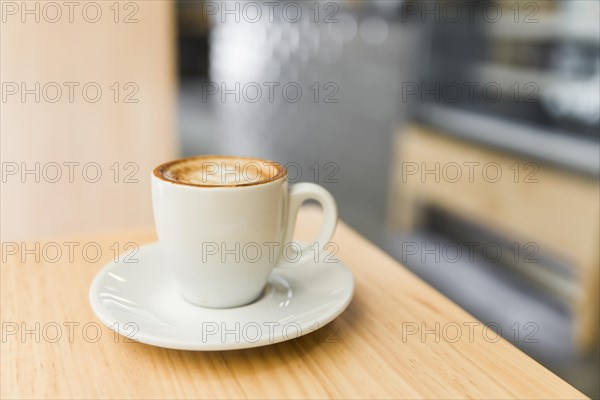 Close up coffee latte wooden table