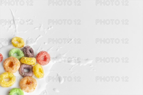 Close up colorful cereal with splash milk