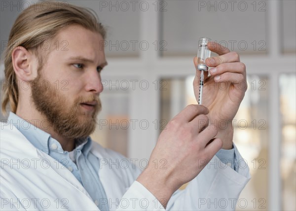 Close up doctor preparing injection