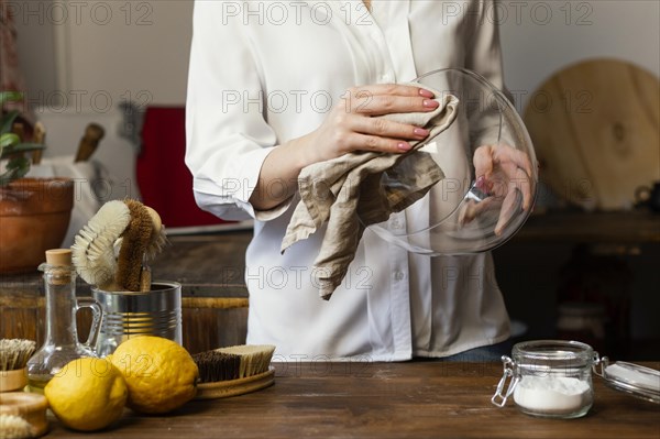 Close up hands cleaning bowl