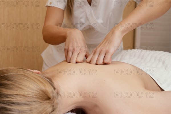 Close up hands massaging back