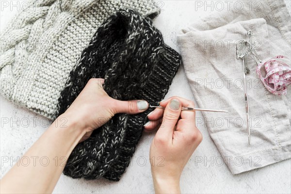 Close up person s hand crocheting with wool