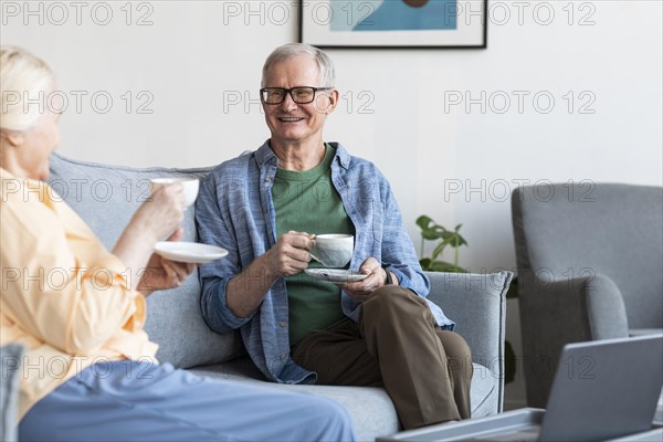 Close up retired couple living room