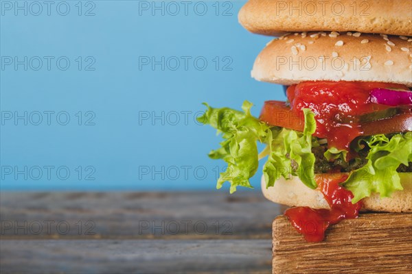 Close up tasty burger with tomato sauce