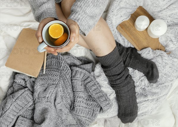 Close up woman bed drinking tea