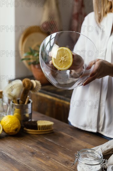 Close up woman cleaning bowl