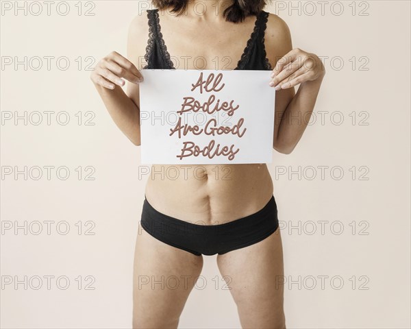 Close up woman holding positive message