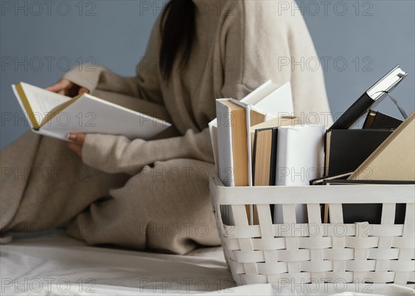 Close up woman with books basket