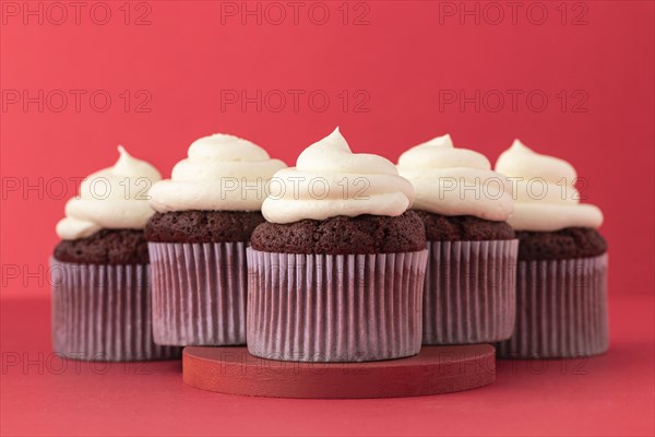 Delicious cupcakes with cream arrangement