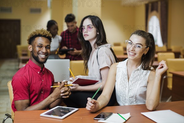 Diverse students posing classroom