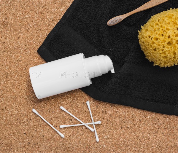 Elevated view bath sponge toothbrush towel cosmetic bottle cotton swab cork backdrop