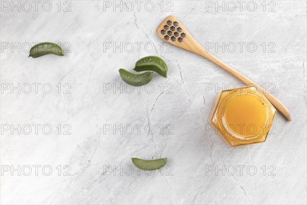 Flat lay cream aloe vera slices marble background