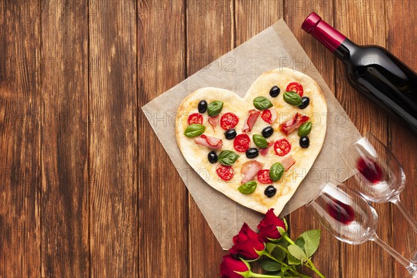 Flat lay romantic dinner table with pizza