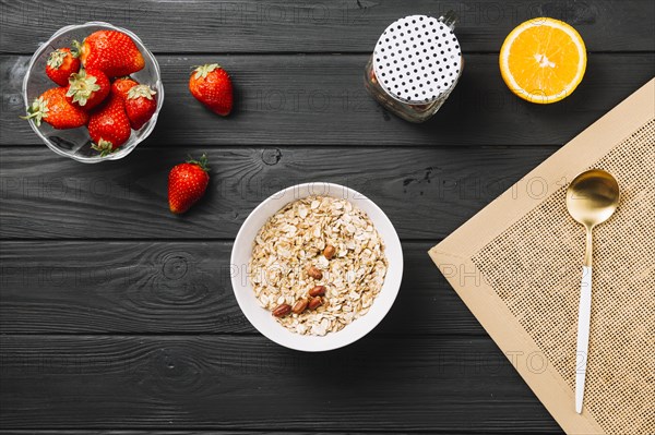 Fresh delicious breakfast with fruits textured wooden plank