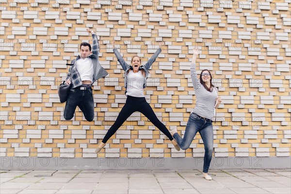 Friends jumping outside