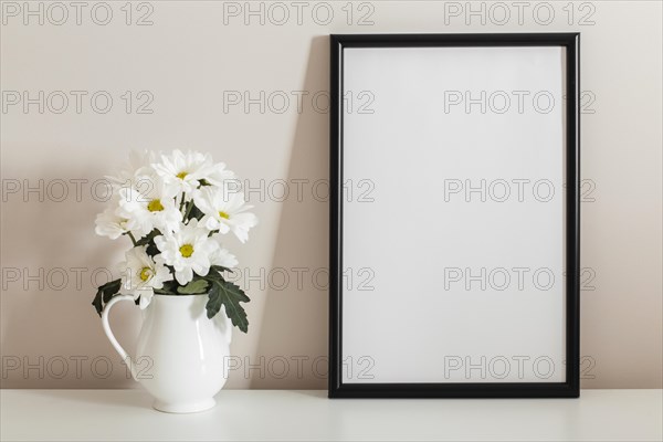 Front view bouquet white flowers vase with empty frame