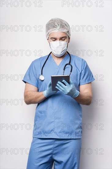 Front view male nurse checking information