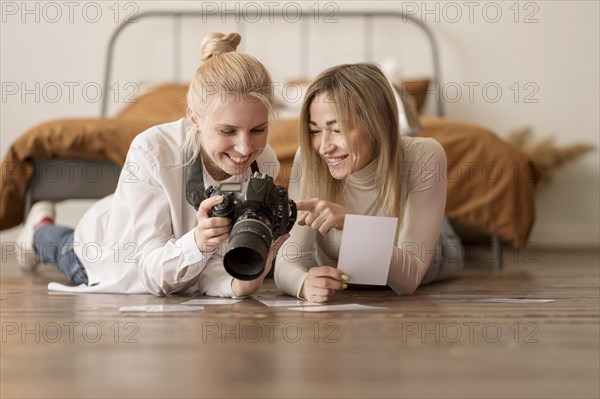 Girls sitting floor looking s