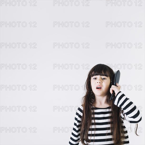 Girl with hairbrush