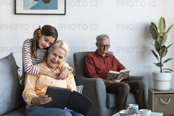 Granddaughter hugging woman medium shot