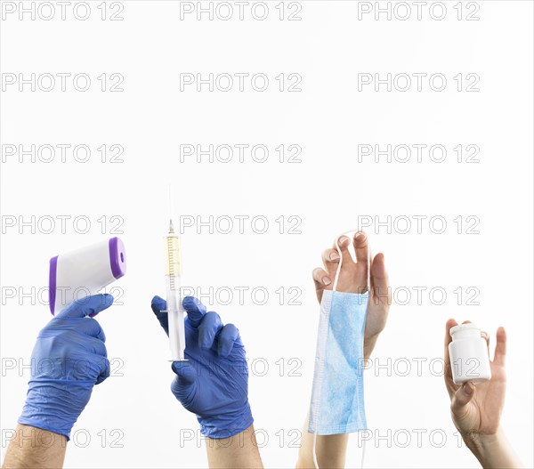 Hands holding medicine items