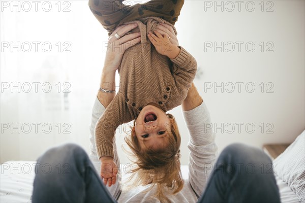 Happy child arms upside down