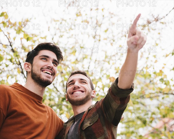 Happy friends looking into distance