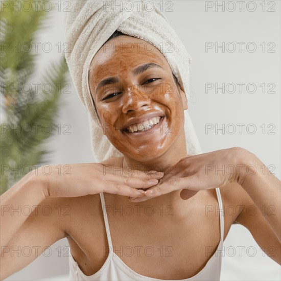 Happy woman using natural face mask 2