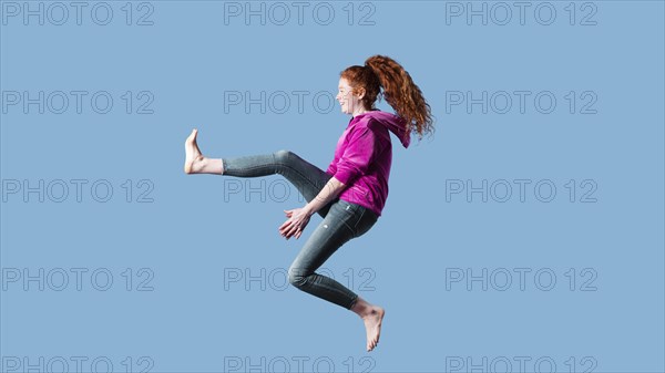 Happy young woman jumping 13